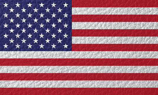 Old  grunge USA Flag background texture.  Background on the theme of patriotism, USA Independence Day. Retro style.