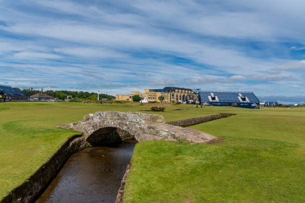 view of the historic Swilcan Bridge and 18th hole of the Old Course at St. Andrewsd during the 150th anniversary of the Open Championship St. Andrews, United Kingdom - 22 June, 2022: view of the historic Swilcan Bridge and 18th hole of the Old Course at St. Andrewsd during the 150th anniversary of the Open Championship 150th anniversary stock pictures, royalty-free photos & images