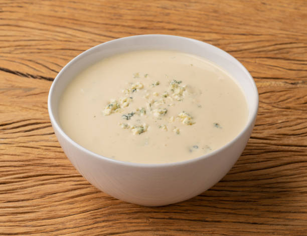 istock Cheese soup in a bowl over wooden table 1404499855