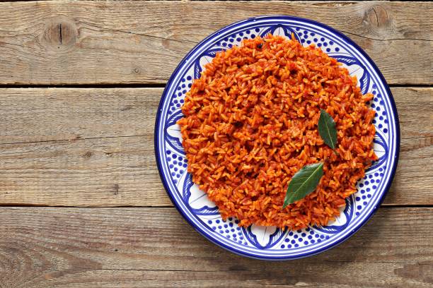 Jollof Rice. Jollof Rice. Traditional Nigerian dish. Flat layot tomato rice stock pictures, royalty-free photos & images