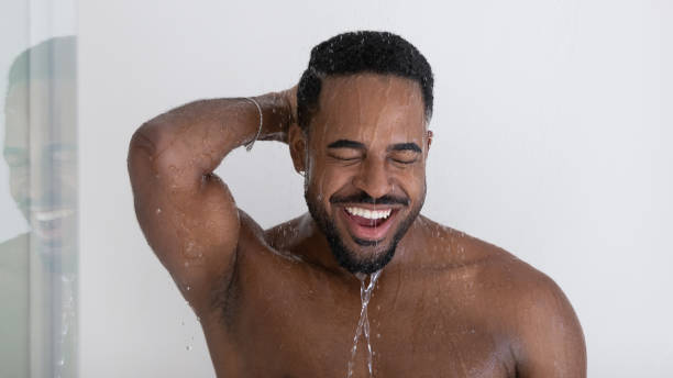istock Head shot portrait African man take shower 1404502156