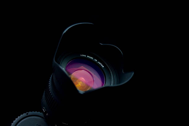istock Close-up of black camera lens on black background 140450308