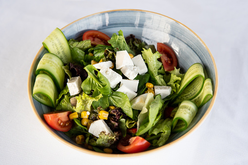 Crispy organic green salad with corn and feta cheese