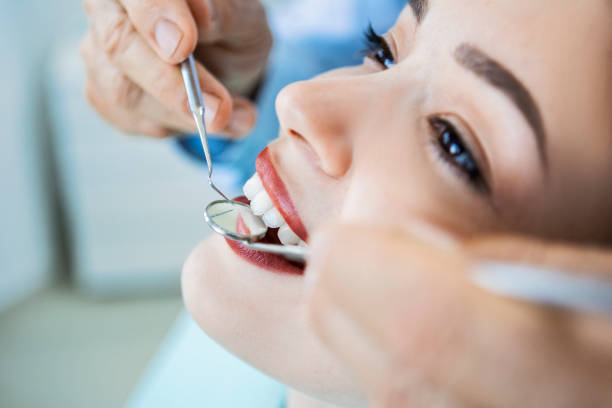 istock Dentist with patient close up 1404504177
