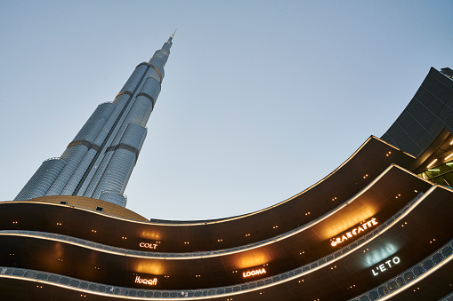 Vertical view of Dubai skyline with blue sky, UAE.