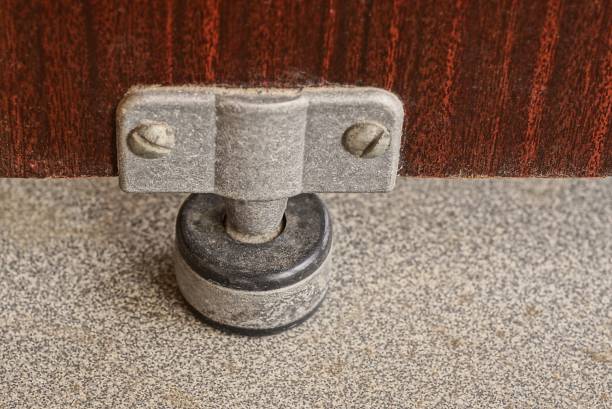 istock black metal leg on a brown wooden bedside table 1404508143