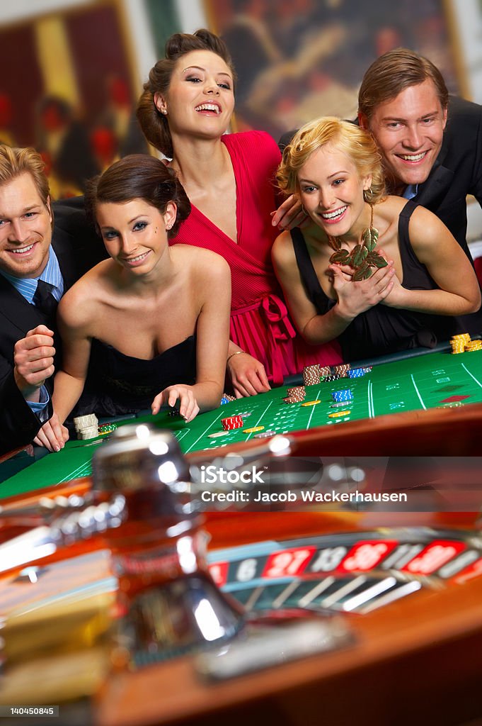 Group of people enjoying in casino Casino Stock Photo
