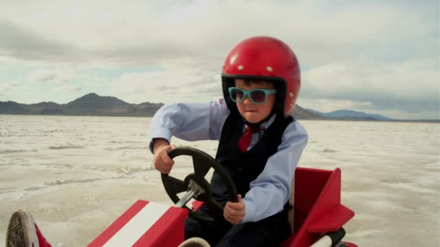 Young Boy Businessman in Race Car