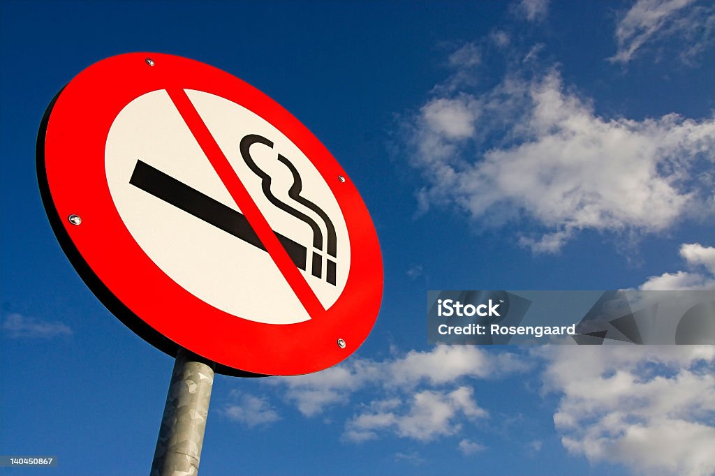 no smoking sign no smoking sign against the blue sky No Smoking Sign Stock Photo