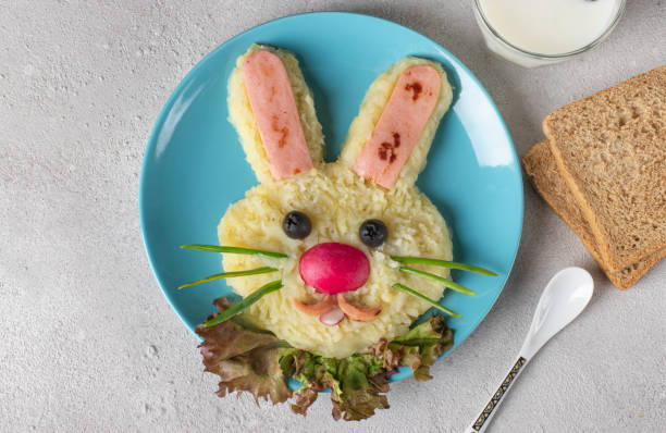 istock Funny bunny from mashed potato and sausages for breakfast kids meal 1404512278