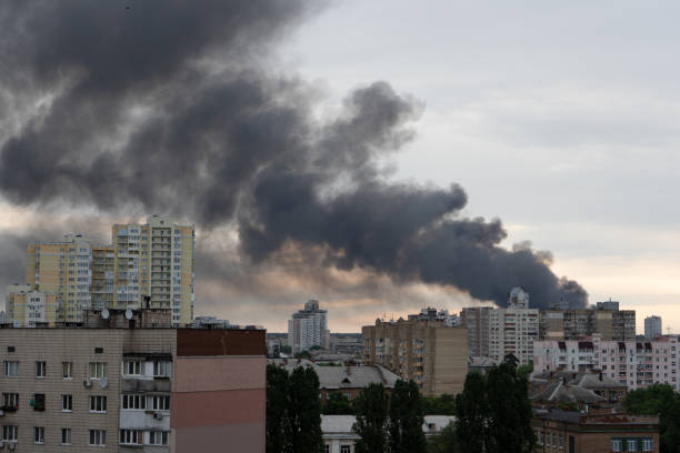 istock Thick smoke in the clouds, fire in city. 1404512400