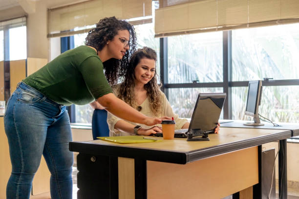 istock Two women in a office 1404513389