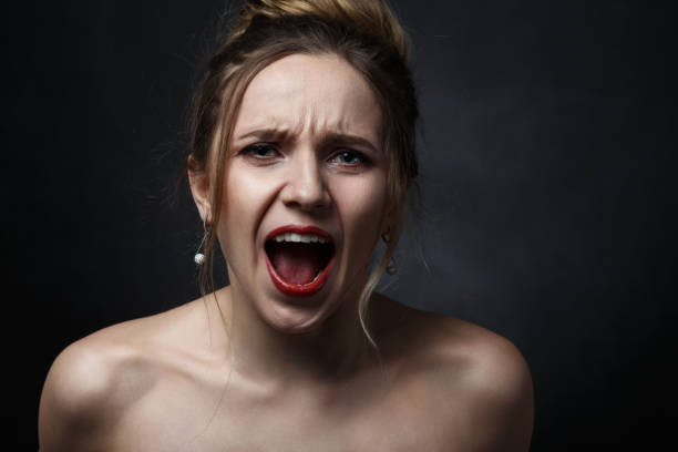 istock angry woman screaming 1404513697