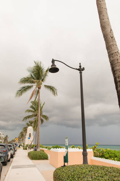 worth avenue clock tower on stormy afternoon in palm beach, florida in the spring of 2022 - florida weather urban scene dramatic sky imagens e fotografias de stock