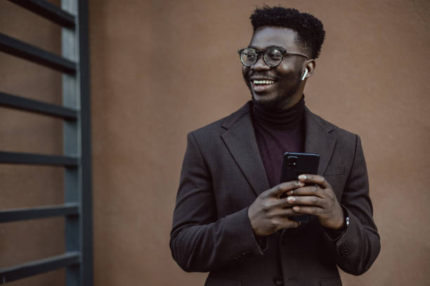 istock Elegant businessman uses technology 1404515331