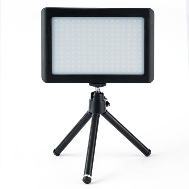 istock LED panel for video filming, LED lamp, on a white background on a tripod 1404515401