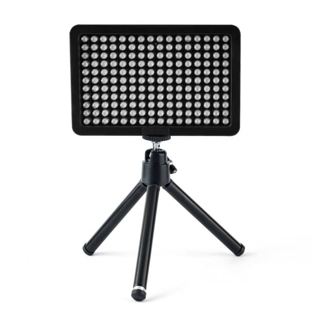 istock LED panel for video filming, LED lamp, on a white background on a tripod 1404515413