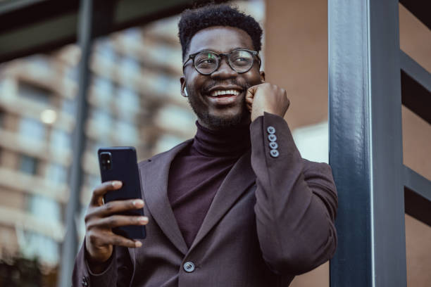istock Young good looking African-American businessmen using smart phone 1404516466