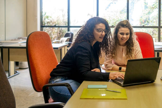 istock Two women in a office 1404517242