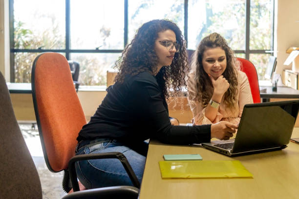 istock Two women in a office 1404517254