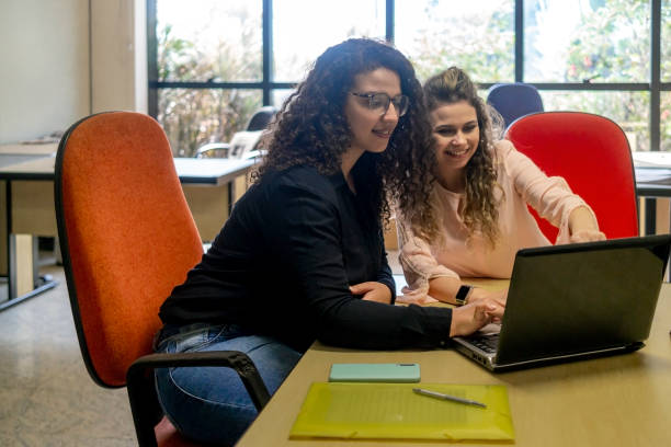 istock Two women in a office 1404517269