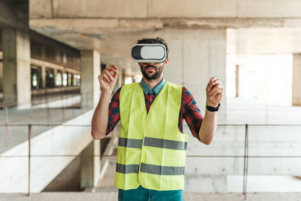 istock Man inspector analyzing the work of builders using virtual reality glasses. 1404518645