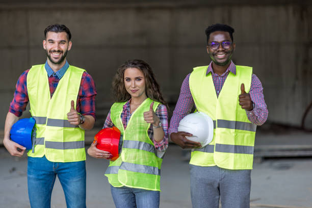 istock Portrait of smiling construction workers 1404518724