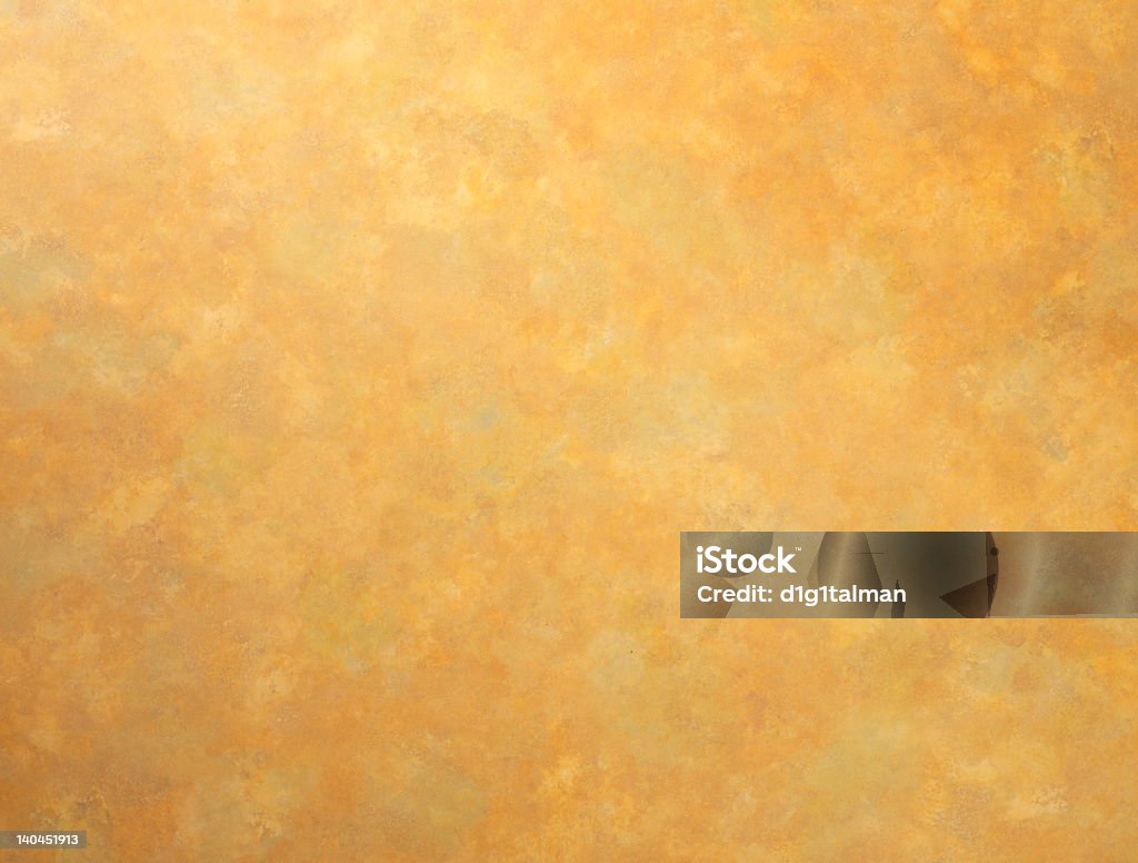 Mottled Gold A mottled, gold colored background with a hand painted feel. Artificial Stock Photo
