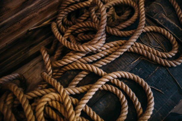 istock Rope on a ship on a wooden background. 1404519798