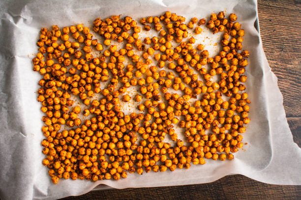 istock Spiced Chickpeas on a Parchment Lined Sheet Pan: Garbanzo beans tossed in sumac and other spices before roasting 1404521459