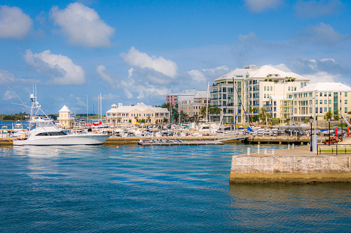 Yachts and sailboats are docked on the Hamilton, Bermuda waterfront just steps from shops and restaurants.
