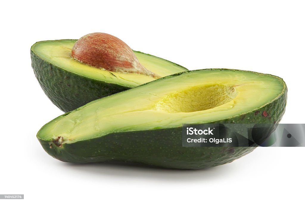 Avocado-oily nutritious fruit Avocado-oily nutritious fruit.Two fleshy halfs on white background Avocado Stock Photo