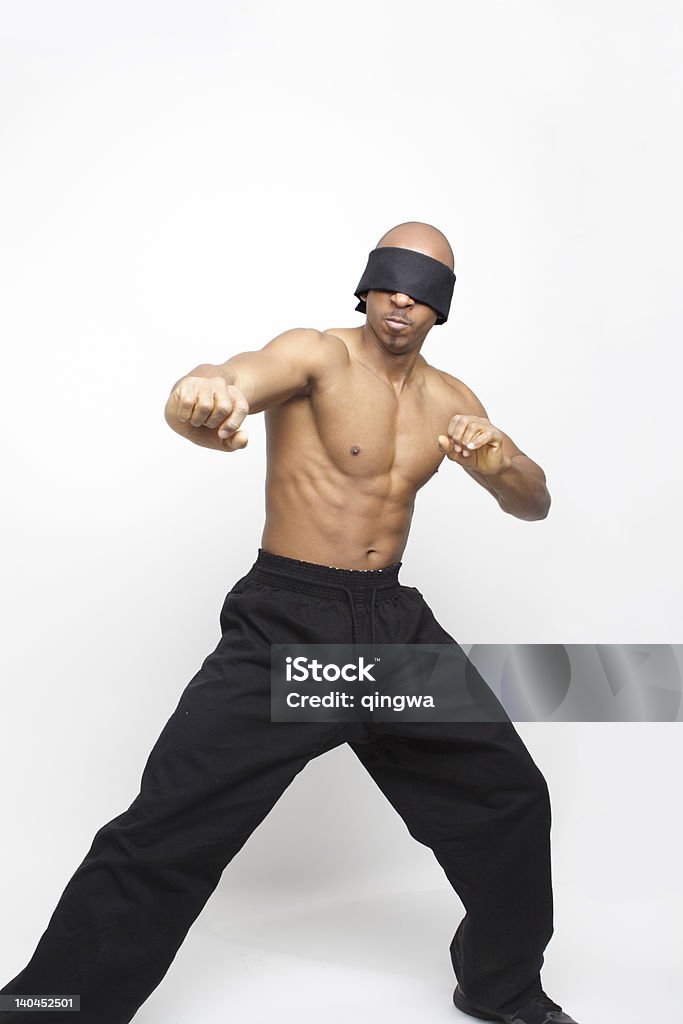 Blindfolded African American Man Shadowboxing Martial Arts Isolated Gray Background Blindfolded man boxing 20-29 Years Stock Photo