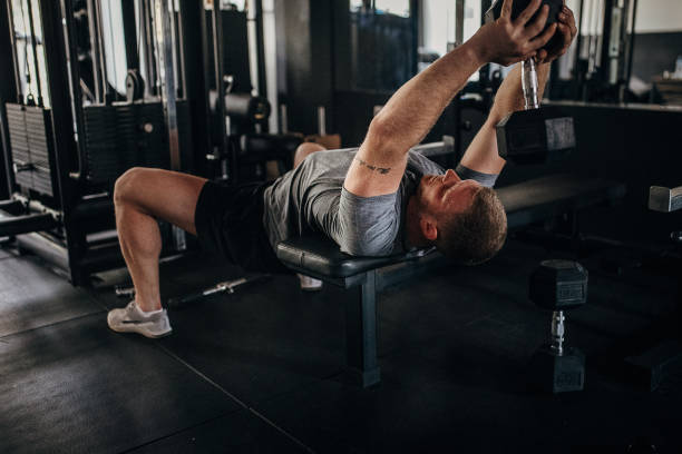 istock Man body building in gym 1404525031