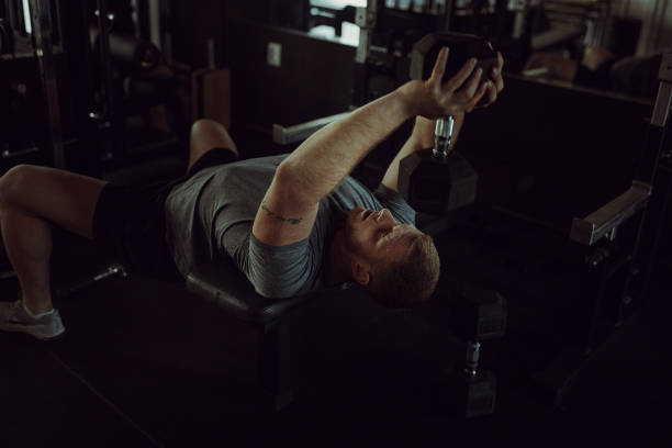 istock Man body building in gym 1404525056