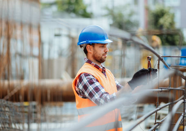 istock Blue collar worker working on the armature on construction site 1404525397