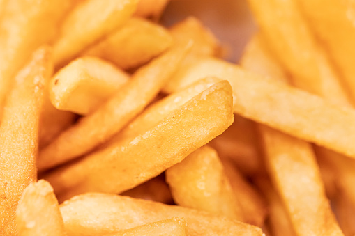 French fries in macro photography ready to eat.
