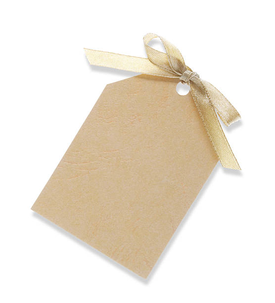 istock yellow gift tag tied with ribbon (including clipping path) 140452769