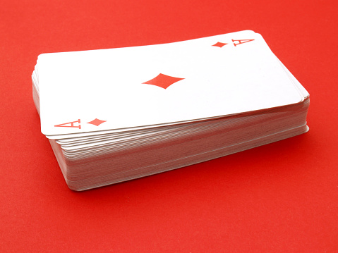 Ace of diamonds on card stack