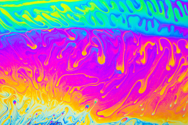 istock Psychedelic multicolored background abstract. Rainbow colors. patterns background. Photo macro shot of soap bubbles 1404529958