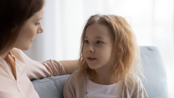 istock Millennial mum holding sincere trusted conversation with cute daughter. 1404530754