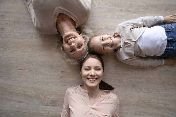 istock Above top view three generations family lying on floor. 1404531501