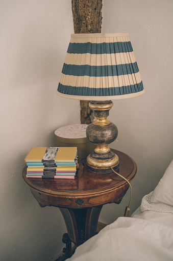 With a lamp and books