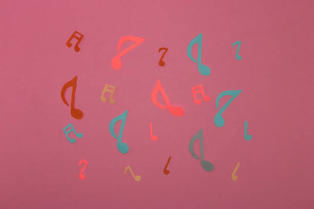 istock colorful music notes on a pink background, creative music design 1404532170