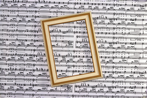 wooden frame on black and white music background, creative art design