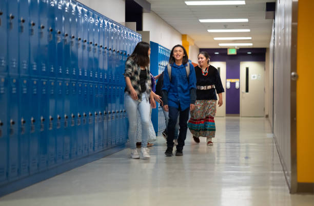 istock Kids getting put of the classroom walking on a corridor 1404533693