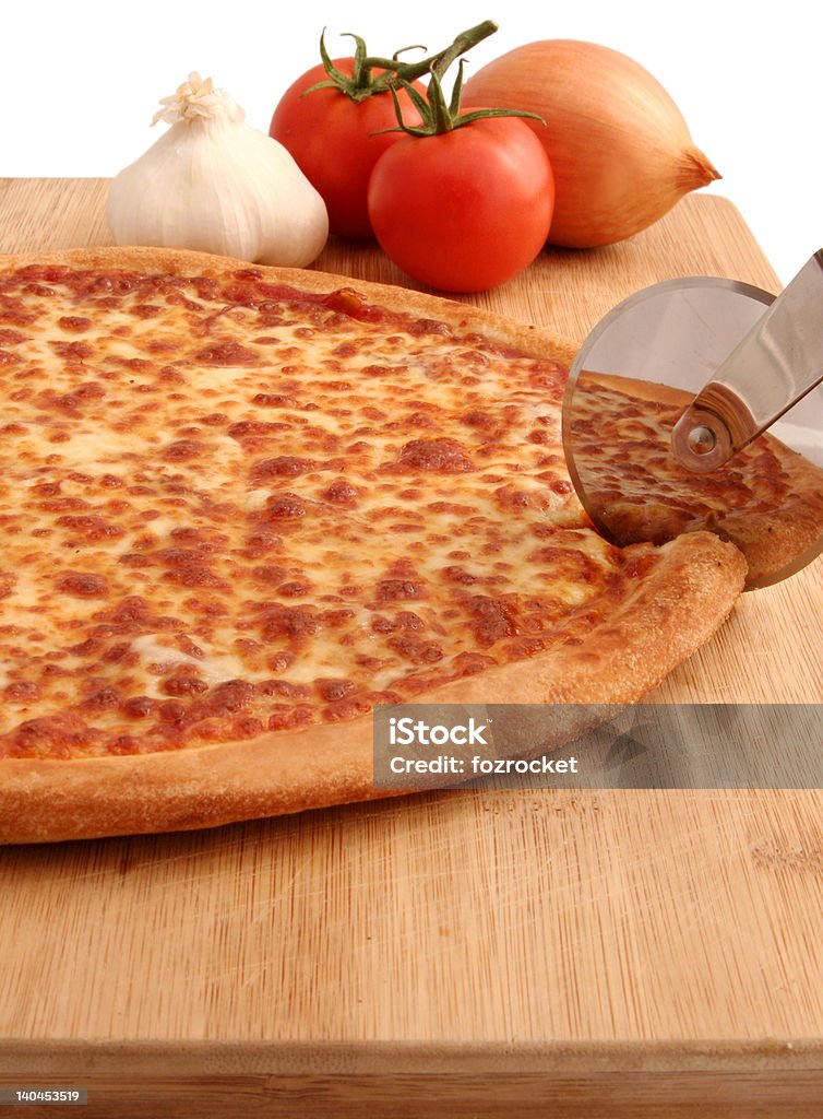 Pizza A pepperoni pizza being cut on board - isolated with clipping path Baked Pastry Item Stock Photo