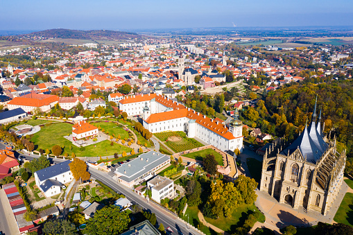 Panoramic view from drone of Czech town of Kutna Hora overlooking medieval Jesuit College and St. Barbara Cathedral on sunny autumn day, Central Bohemian Region