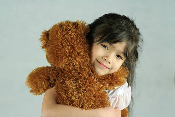 istock Little girl hugging her teddy bear 140454220