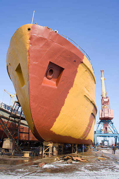 The ship being on repair in a shipyard stock photo